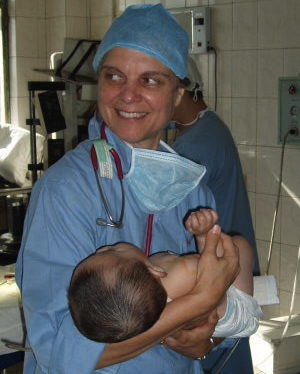Doctor holding child